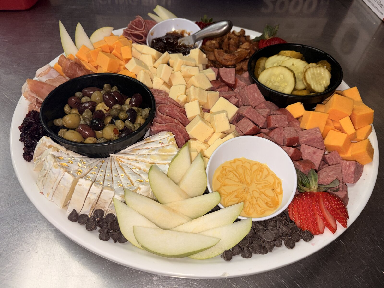 Charcuterie & cheese round with olives and fruit