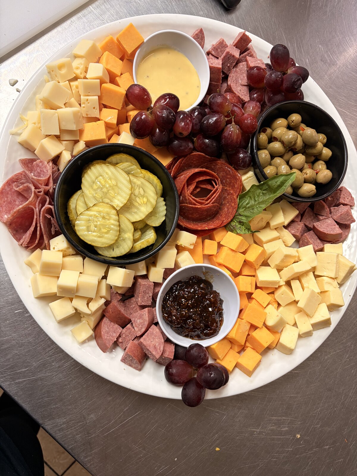 Charcuterie round with fruit and crackers