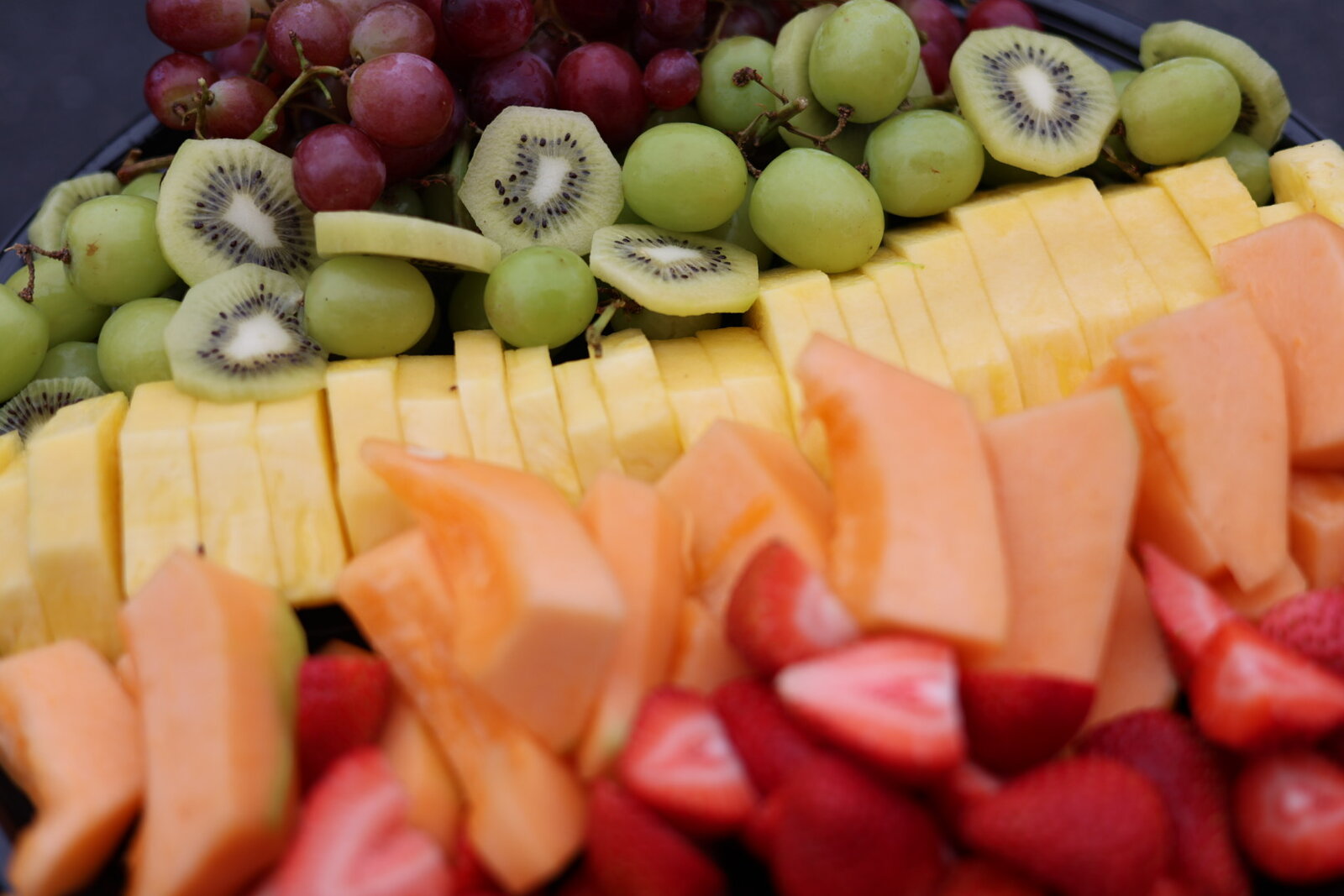 Berry and kiwi fruit trays with pastries