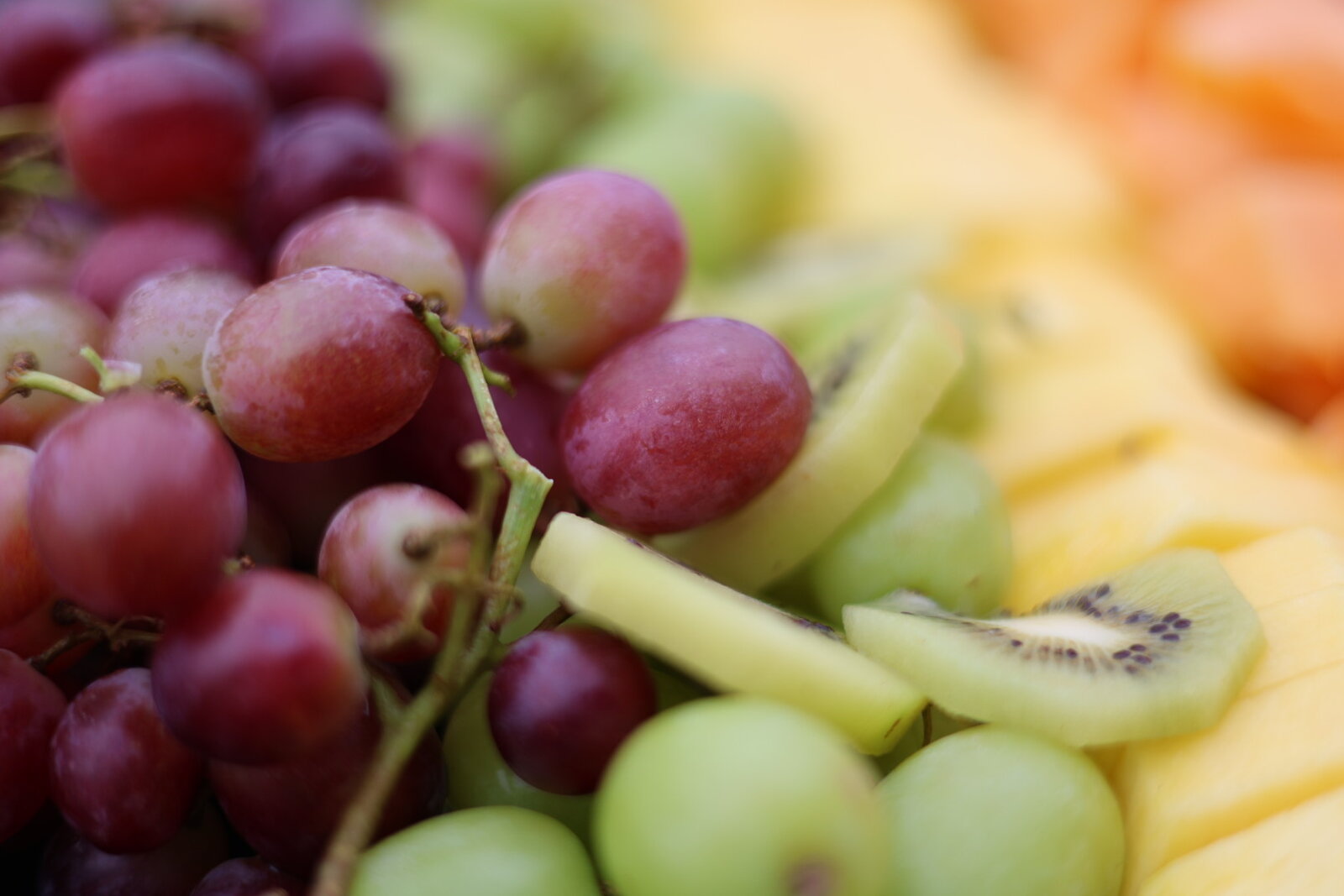 Sliced melon, grapes and strawberries